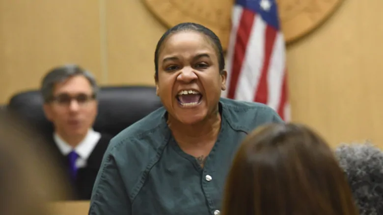 Mitchelle Blair is seen yelling out inside the Lincoln Hall of Justice in Detroit on April 8, 2015