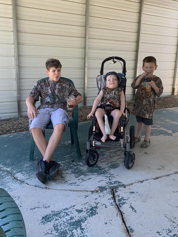 Grayson with two older siblings