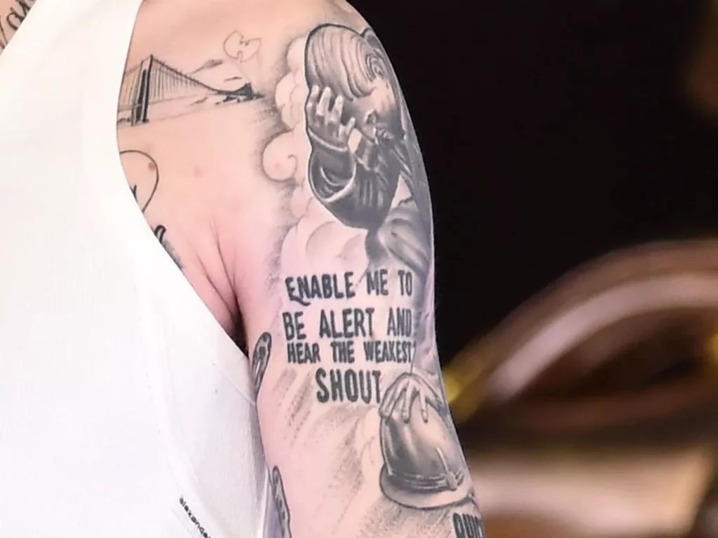kneeling firefighter tattoo on Davidson's left arm