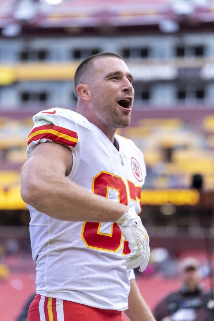 Travis Kelce in Kansas City Chiefs uniform on the field during a game.